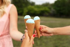 Girl hold icecream cone in hand