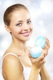Girl Holding A Box Of Cosmetic Cream Royalty Free Stock Images