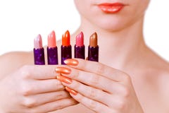 Girl Holding Five Lipsticks Royalty Free Stock Images