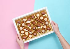 Girl Holding Her Hands A Box Of Chocolates Stock Photos