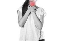 Girl holding her throat. Sore throat. Angina. Close up. Isolated stock photography Girl holding her throat. Sore throat. Angina. Close up. Isolated stock photography