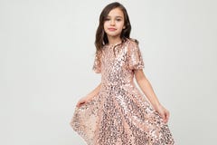 Girl In A Dress For The Holiday Posing On A White Studio Background Royalty Free Stock Photography Girl In A Dress For The Holiday Posing On A White Studio Background Royalty Free Stock Photography
