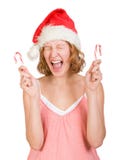 Girl In A Santa Clause Cap With Candy Canes Royalty Free Stock Photography