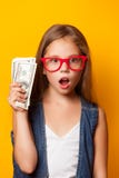 Girl In Red Glasses With Money Stock Photography