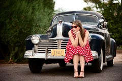 Girl In Red With Vintage Car Royalty Free Stock Image