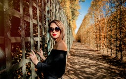Girl In Sunglasses In Autumn Season Park Royalty Free Stock Photo