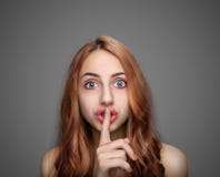 Girl keeping finger on her lips . stock photography Girl keeping finger on her lips . stock photography