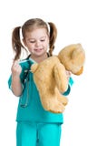 Girl kid playing a doctor isolated on white stock images Girl kid playing a doctor isolated on white stock images