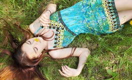 Girl Lies On Grass Royalty Free Stock Photography