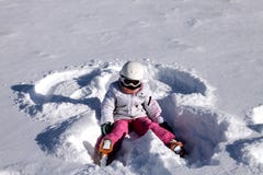 Girl Lies On Snow. Snow Angel Royalty Free Stock Photo