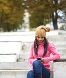 Girl listening music with her headphones in the street stock photos Girl listening music with her headphones in the street stock photos