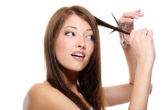 Girl long straight hair cutting them with scissor Royalty Free Stock Photo Girl long straight hair cutting them with scissor Royalty Free Stock Photo