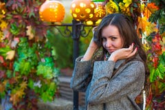 A woman in a gray coat and colored scarf in autumn in Moscow. royalty free stock image A woman in a gray coat and colored scarf in autumn in Moscow. royalty free stock image