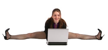 Girl Makes Splits And Works With Laptop. Stock Photos