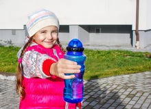 Girl Offers A Water Bottle Stock Photos