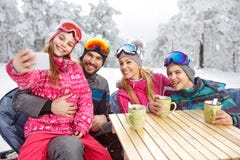 Girl with parents and brother making selfie at winter holiday. In cafe Royalty Free Stock Photo Girl with parents and brother making selfie at winter holiday. In cafe Royalty Free Stock Photo