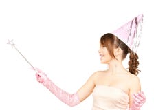 Girl in party cap with magic stick