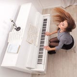 Girl Play Piano Stock Photography