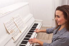 Girl Play Piano Stock Photography