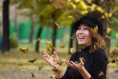 Girl playing autumn foliage