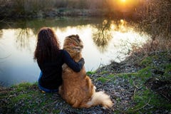 Girl playing with Caucasian shepherd dog, autumn royalty free stock photography Girl playing with Caucasian shepherd dog, autumn royalty free stock photography