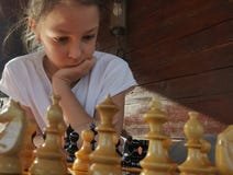 Girl playing chess stock photo Girl playing chess stock photo