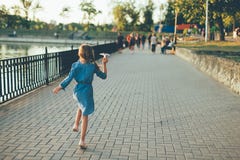 Girl Playing, Running With Toy Paper Airplane Royalty Free Stock Photos