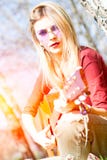 Girl plays guitar royalty free stock photography Girl plays guitar royalty free stock photography