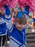 Girl with pompoms in a parade