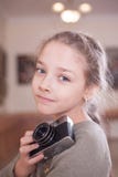 Girl with a retro camera makes a photo stock images Girl with a retro camera makes a photo stock images