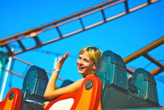 Girl Riding On A Roller Coaster Stock Photography