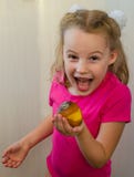 Girl with a rotten pear concept of spoiled food and eating it royalty free stock photo Girl with a rotten pear concept of spoiled food and eating it royalty free stock photo