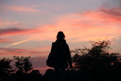 A Girl`s Silhouette at Sunset