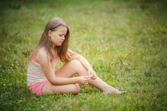Girl Sitting On Green Grass Outdoor Stock Photos