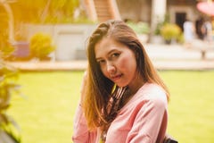 Girl sitting at wooden chair looking. royalty free stock images Girl sitting at wooden chair looking. royalty free stock images