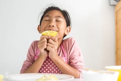 Girl Smelling Homemade Dumpling In Her Hand, Lifestyle Concept Royalty Free Stock Images