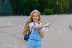 Girl smiling and happy to blow bubbles royalty free stock photos Girl smiling and happy to blow bubbles royalty free stock photos