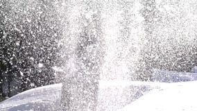 Girl and Snow. Girl throws fluffy snow on a background of a snowy landscape. Backlit sunlight. Slow Motion at a rate of 240 fps Girl and Snow. Girl throws fluffy snow on a background of a snowy landscape. Backlit sunlight. Slow Motion at a rate of 240 fps