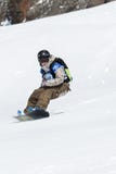 Girl snowboarder rides steep mountains. Kamchatka, Far East, Russian Federation royalty free stock images Girl snowboarder rides steep mountains. Kamchatka, Far East, Russian Federation royalty free stock images