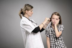 Girl Suffering And Doctor Treating Stock Photography Girl Suffering And Doctor Treating Stock Photography