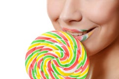 The girl with a sugar candy isolated on white stock photos The girl with a sugar candy isolated on white stock photos