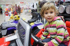 Girl in supermarket alone in department of toys stock photos Girl in supermarket alone in department of toys stock photos