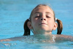 Girl Swimming In The Pool Stock Photo