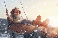 Girl on swing in sunset winter stock images Girl on swing in sunset winter stock images