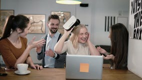 Girl takes off her glasses virtual reality after using the new app share experiences with team in the startup office. Royalty Free Stock Photo Girl takes off her glasses virtual reality after using the new app share experiences with team in the startup office. Royalty Free Stock Photo