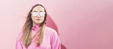 Girl in trendy painted glasses in pink jacket stock photos Girl in trendy painted glasses in pink jacket stock photos
