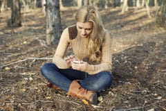 Girl using internet wireless on smartphone in natu Royalty Free Stock Photo Girl using internet wireless on smartphone in natu Royalty Free Stock Photo