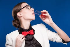 Girl with a vial in his hand and a red butterfly on her neck Stock Image Girl with a vial in his hand and a red butterfly on her neck Stock Image