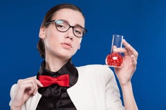 Girl with a vial in his hand and a red butterfly on her neck Royalty Free Stock Photography Girl with a vial in his hand and a red butterfly on her neck Royalty Free Stock Photography