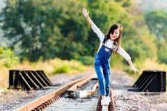 https://thumbs.dreamstime.com/t/girl-walk-railway-young-asian-thai-walking-forest-background-68875465.jpg